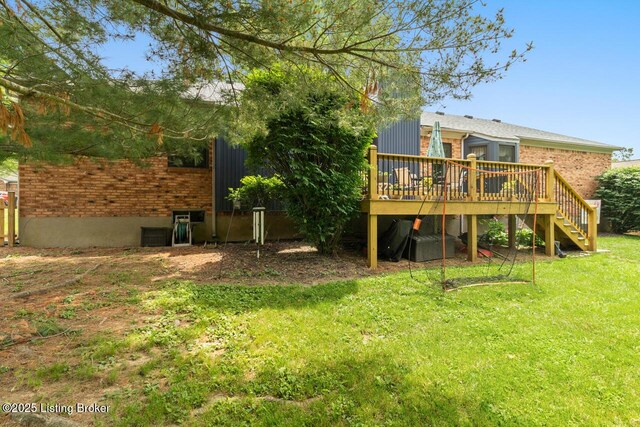 12115 Alpine Way, Goshen, KY 40026 - back of property featuring brick siding, a wooden deck, stairway, and a lawn