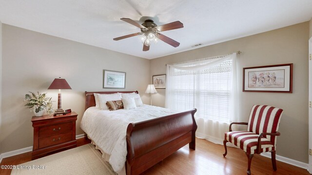 10409 Pine Glen Cir, Louisville, KY 40291 - bedroom featuring wood finished floors, baseboards, and a ceiling fan
