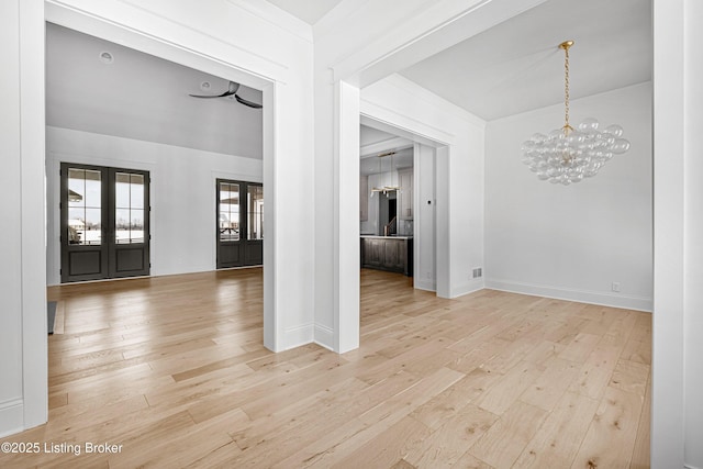 4907 Sycamore Ridge Ln, La Grange, KY 40031 - spare room featuring light wood-style floors, a chandelier, and baseboards
