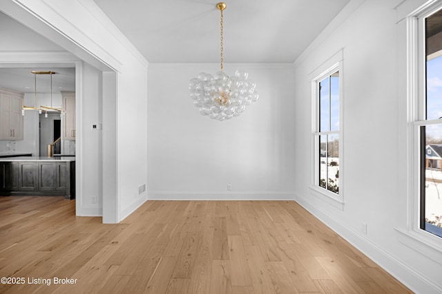 4907 Sycamore Ridge Ln, La Grange, KY 40031 - unfurnished dining area with a chandelier, light wood-style floors, and baseboards
