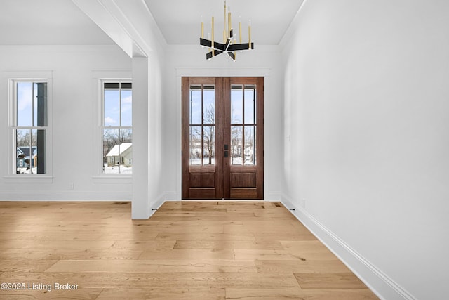 4907 Sycamore Ridge Ln, La Grange, KY 40031 - foyer with light wood-style flooring, french doors, baseboards, and a chandelier