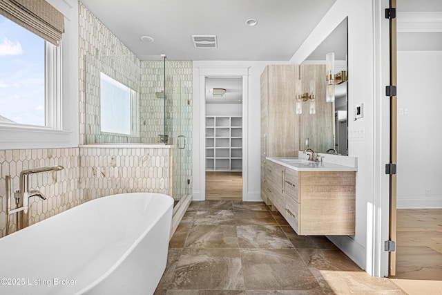 4907 Sycamore Ridge Ln, La Grange, KY 40031 - bathroom with a freestanding tub, a shower stall, vanity, and a walk in closet