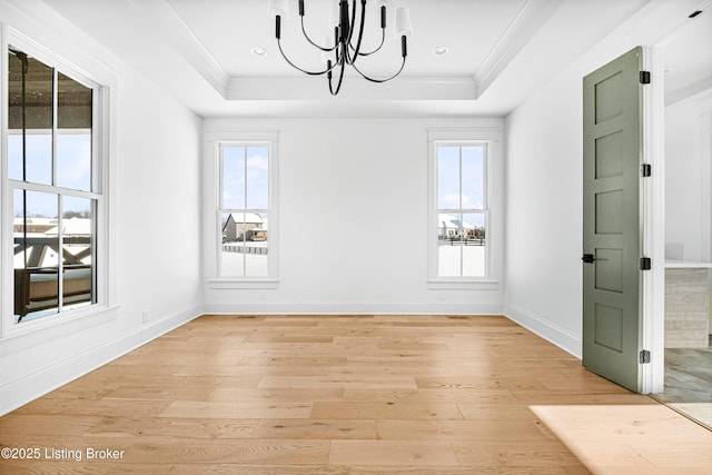 4907 Sycamore Ridge Ln, La Grange, KY 40031 - unfurnished dining area with a tray ceiling, light wood-style floors, a chandelier, plenty of natural light, and ornamental molding