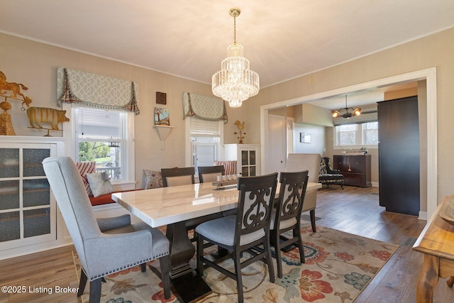 5971 State Road 62, Georgetown, IN 47122 - dining space featuring a chandelier, wood finished floors, and ornamental molding