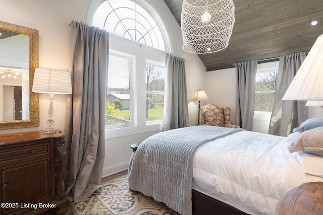 5971 State Road 62, Georgetown, IN 47122 - bedroom featuring vaulted ceiling, wood finished floors, and baseboards