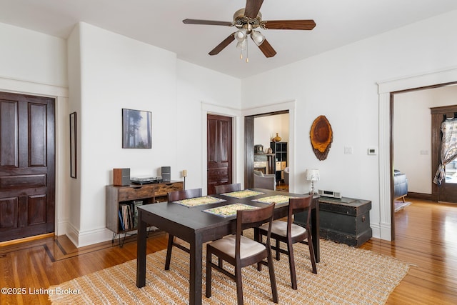 2023 Alta Ave, Louisville, KY 40205 - dining space with light wood-type flooring, a ceiling fan, baseboards, and a desk