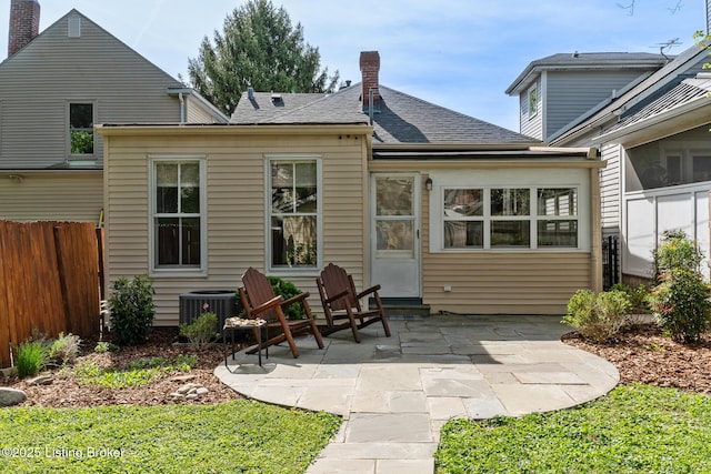 2023 Alta Ave, Louisville, KY 40205 - rear view of property with cooling unit, a patio area, a chimney, and roof with shingles