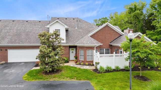 10119 Vista Springs Way, Louisville, KY 40291 - view of front of property featuring a shingled roof, brick siding, asphalt driveway, and a garage