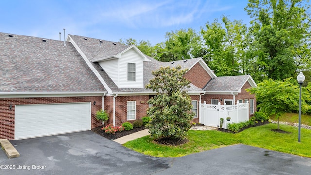 10119 Vista Springs Way, Louisville, KY 40291 - view of front of property with driveway, brick siding, an attached garage, and roof with shingles