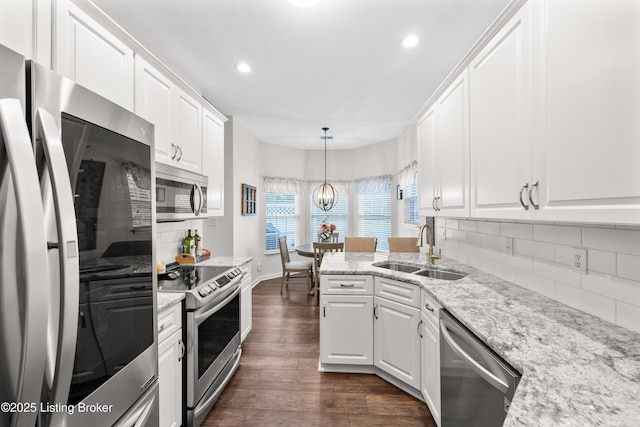 10119 Vista Springs Way, Louisville, KY 40291 - kitchen with stainless steel appliances, a sink, dark wood-style flooring, white cabinets, and recessed lighting