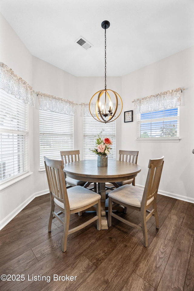 10119 Vista Springs Way, Louisville, KY 40291 - dining space with a chandelier, dark wood finished floors, and baseboards