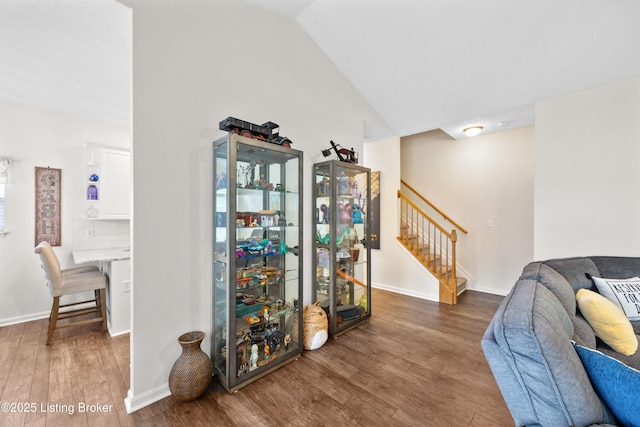 10119 Vista Springs Way, Louisville, KY 40291 - living area with stairway, wood finished floors, vaulted ceiling, and baseboards