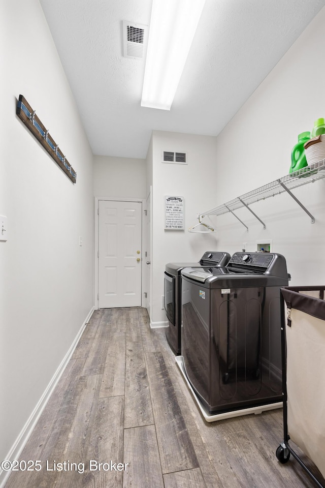 10119 Vista Springs Way, Louisville, KY 40291 - washroom with wood finished floors, washing machine and clothes dryer, and baseboards