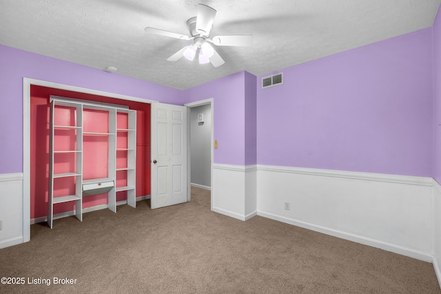 1312 Pollitt Ct, Louisville, KY 40223 - unfurnished bedroom featuring carpet, a textured ceiling, a ceiling fan, and baseboards