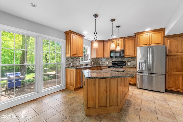1312 Pollitt Ct, Louisville, KY 40223 - kitchen with black appliances, brown cabinets, decorative backsplash, and recessed lighting