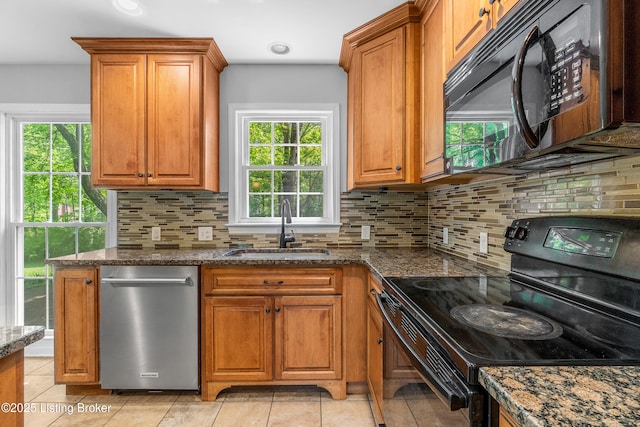 1312 Pollitt Ct, Louisville, KY 40223 - kitchen featuring black appliances, a sink, brown cabinets, dark stone counters, and tasteful backsplash