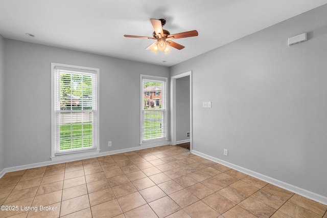 1312 Pollitt Ct, Louisville, KY 40223 - unfurnished room featuring ceiling fan, baseboards, and light tile patterned floors