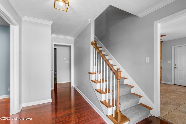 1312 Pollitt Ct, Louisville, KY 40223 - stairway with baseboards, wood finished floors, and ornamental molding