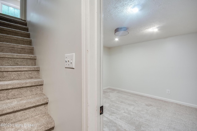 1312 Pollitt Ct, Louisville, KY 40223 - staircase featuring carpet and a textured ceiling
