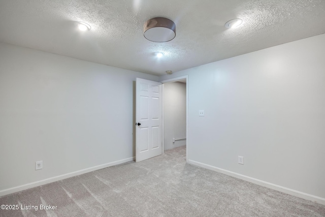 1312 Pollitt Ct, Louisville, KY 40223 - carpeted spare room featuring a textured ceiling and baseboards
