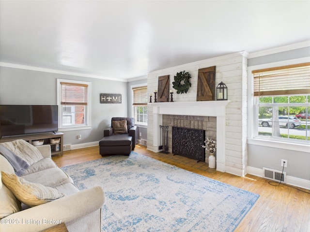 4932 Southern Pkwy, Louisville, KY 40214 - living area with baseboards, crown molding, a brick fireplace, and wood finished floors