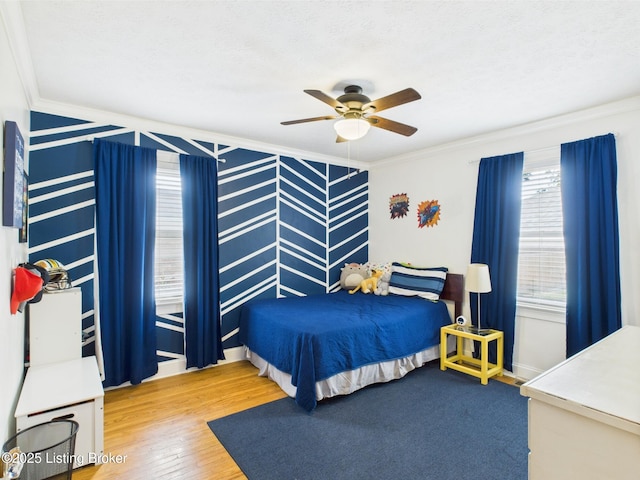 4932 Southern Pkwy, Louisville, KY 40214 - bedroom with crown molding, wood finished floors, ceiling fan, and baseboards