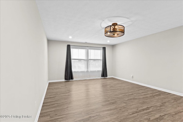 102 Limestone Ct, Shepherdsville, KY 40165 - spare room featuring wood finished floors, baseboards, recessed lighting, and a textured ceiling