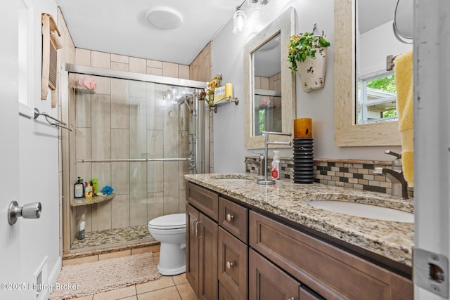 94 Tarnwood Dr, Brandenburg, KY 40108 - full bathroom featuring a stall shower, double vanity, tile patterned flooring, and toilet