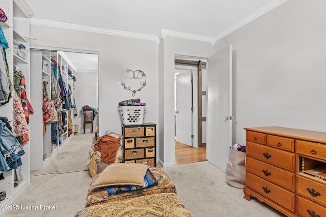 94 Tarnwood Dr, Brandenburg, KY 40108 - bedroom featuring ornamental molding, light carpet, a barn door, and a closet