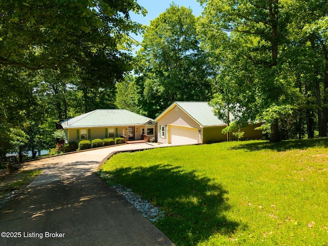 94 Tarnwood Dr, Brandenburg, KY 40108 - ranch-style home featuring asphalt driveway, a front lawn, an attached garage, and metal roof
