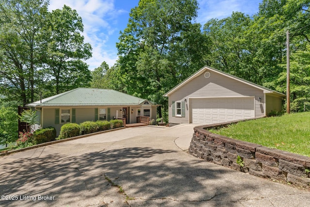 94 Tarnwood Dr, Brandenburg, KY 40108 - ranch-style home with covered porch, driveway, and a detached garage