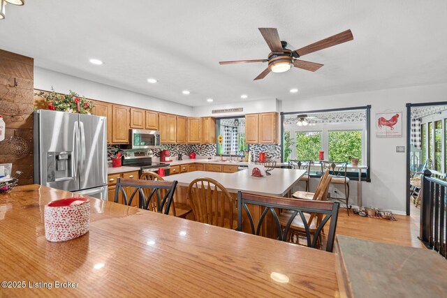 94 Tarnwood Dr, Brandenburg, KY 40108 - dining room featuring plenty of natural light, a ceiling fan, light wood finished floors, and recessed lighting