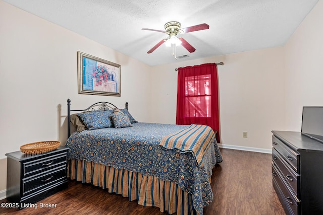 94 Tarnwood Dr, Brandenburg, KY 40108 - bedroom with dark wood finished floors, baseboards, a ceiling fan, and a textured ceiling