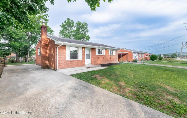 1057 Hillview Blvd, Shepherdsville, KY 40229 - single story home with a chimney, brick siding, driveway, and a gate