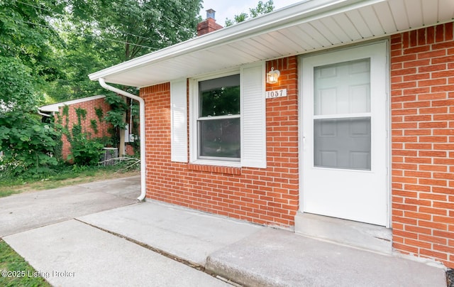 1057 Hillview Blvd, Shepherdsville, KY 40229 - view of exterior entry with brick siding and a chimney