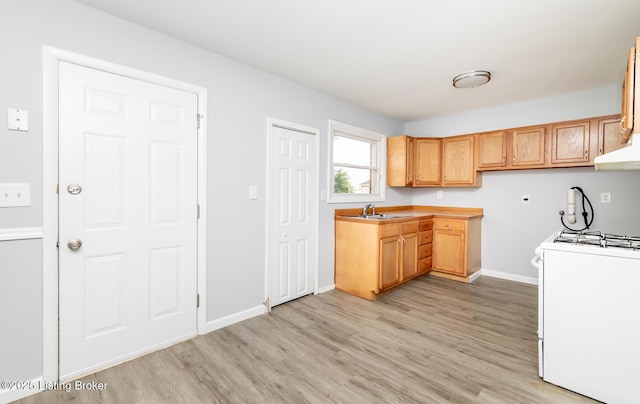 1057 Hillview Blvd, Shepherdsville, KY 40229 - kitchen featuring gas range gas stove, light wood-style flooring, a sink, baseboards, and light countertops