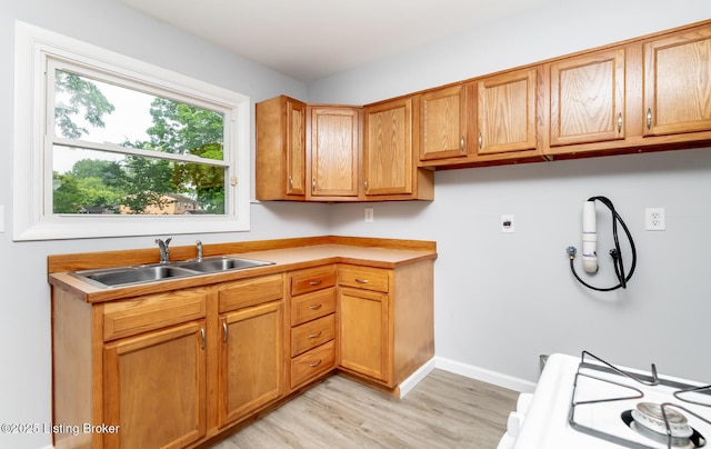 1057 Hillview Blvd, Shepherdsville, KY 40229 - washroom featuring a sink, electric dryer hookup, light wood finished floors, and baseboards