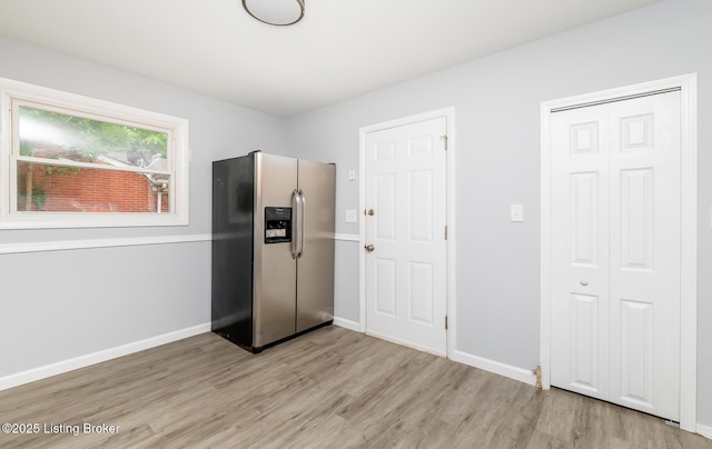 1057 Hillview Blvd, Shepherdsville, KY 40229 - kitchen with stainless steel refrigerator with ice dispenser, light wood-style flooring, and baseboards