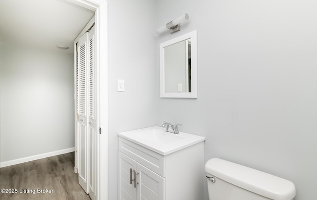 1057 Hillview Blvd, Shepherdsville, KY 40229 - bathroom with vanity, toilet, wood finished floors, and baseboards