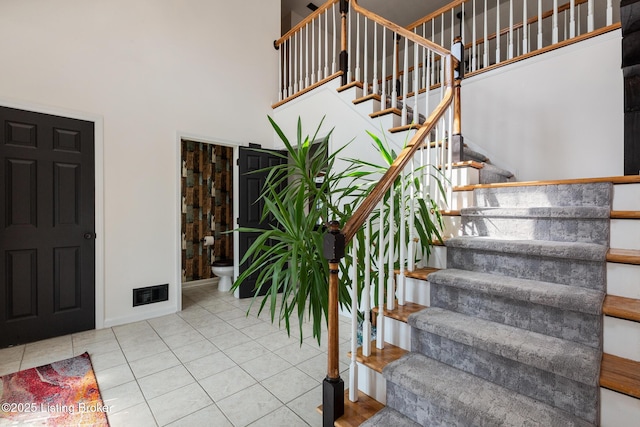 6820 Grandfield Rd, Louisville, KY 40258 - entryway with stairs, tile patterned floors, and a towering ceiling