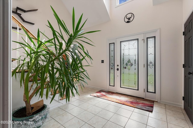 6820 Grandfield Rd, Louisville, KY 40258 - foyer entrance featuring a high ceiling, light tile patterned floors, and baseboards