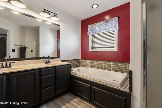 6820 Grandfield Rd, Louisville, KY 40258 - bathroom with wood finished floors, a bath, double vanity, and recessed lighting