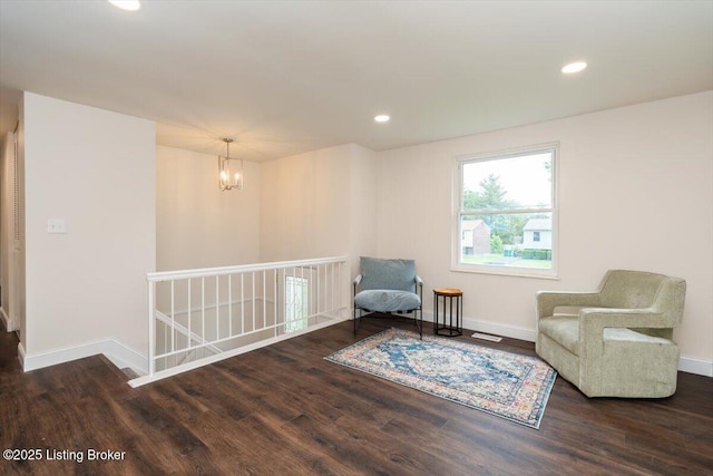 144 Starlite Ct, Louisville, KY 40229 - living area with a chandelier, wood finished floors, baseboards, an upstairs landing, and recessed lighting