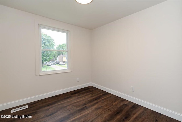144 Starlite Ct, Louisville, KY 40229 - spare room with baseboards and dark wood-style floors