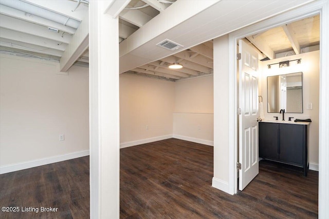 144 Starlite Ct, Louisville, KY 40229 - finished below grade area featuring wood finished floors, baseboards, and a sink