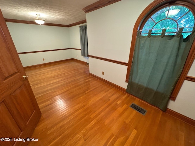 5309 Bardstown Rd, Springfield, KY 40069 - spare room featuring light wood finished floors and crown molding