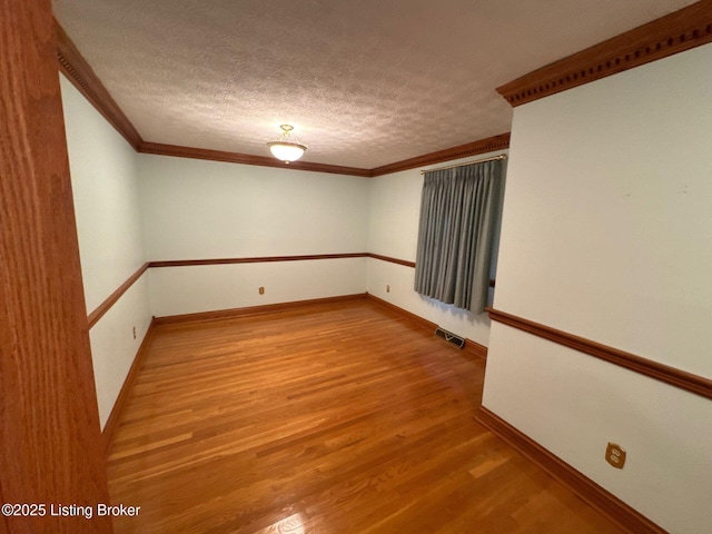 5309 Bardstown Rd, Springfield, KY 40069 - empty room with wood finished floors, ornamental molding, and a textured ceiling