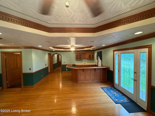 5309 Bardstown Rd, Springfield, KY 40069 - kitchen featuring a peninsula, light wood finished floors, ornamental molding, brown cabinets, and recessed lighting