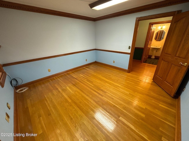 5309 Bardstown Rd, Springfield, KY 40069 - spare room featuring light wood-style flooring and ornamental molding