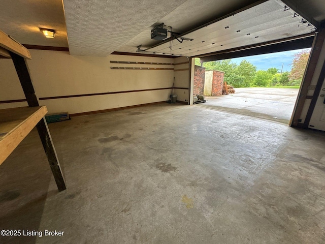 5309 Bardstown Rd, Springfield, KY 40069 - garage with a garage door opener and baseboards